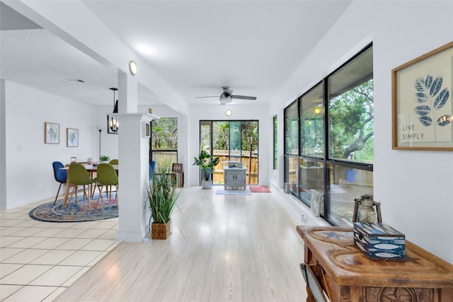 interior space featuring ceiling fan and light hardwood / wood-style flooring