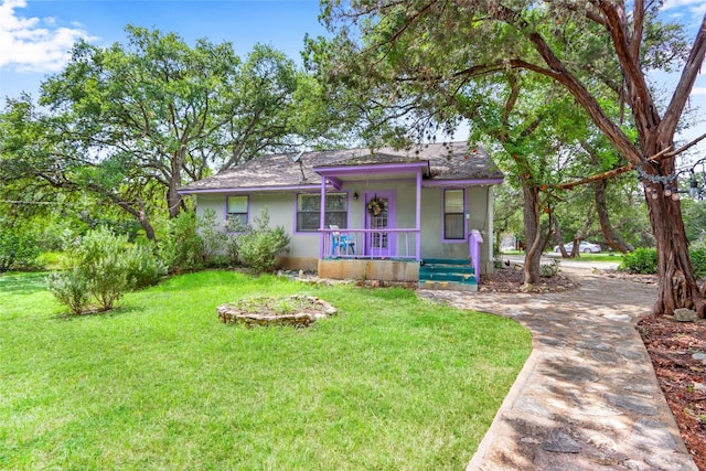 view of front of home featuring a porch and a front yard