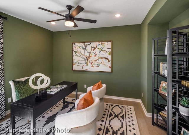 office with ceiling fan and hardwood / wood-style flooring