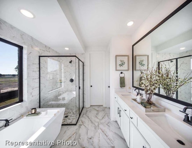 bathroom with independent shower and bath and vanity