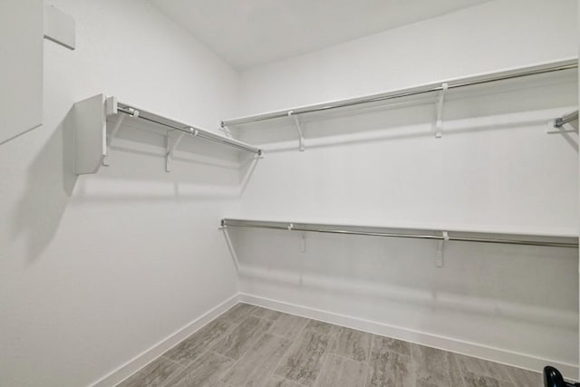 walk in closet featuring hardwood / wood-style floors