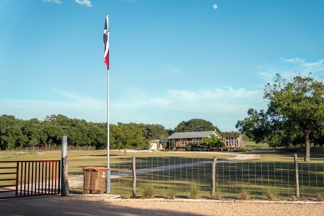 exterior space with a rural view and fence