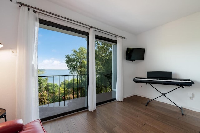 unfurnished room with wood finished floors and baseboards