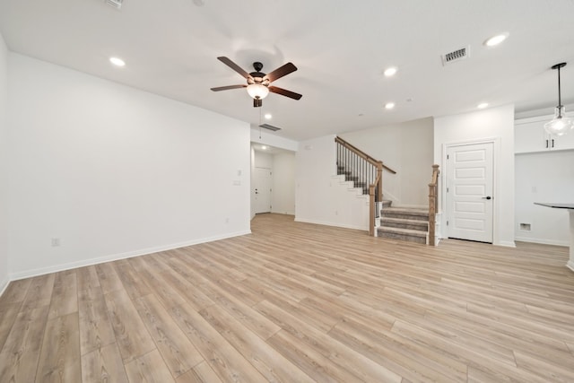 unfurnished living room with ceiling fan and light hardwood / wood-style floors