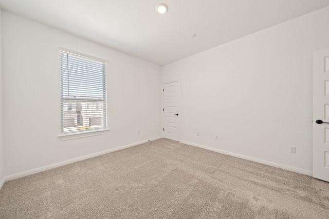 empty room featuring carpet flooring