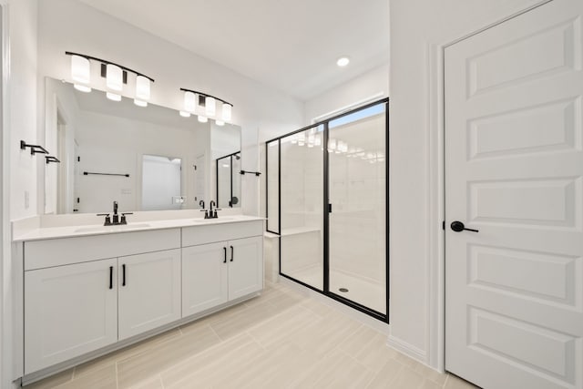 bathroom featuring vanity and an enclosed shower