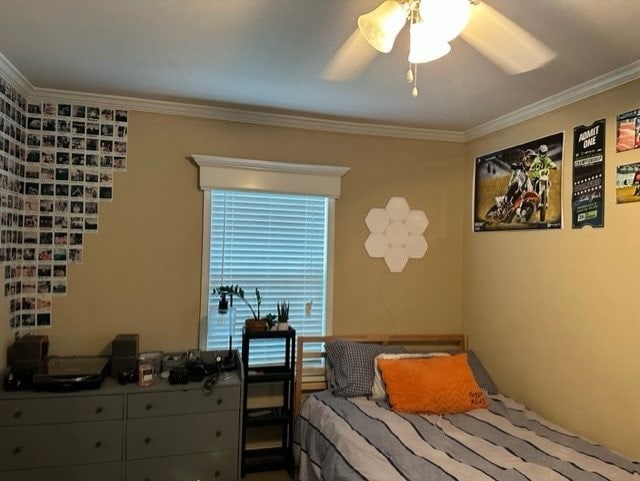 bedroom featuring ceiling fan and ornamental molding
