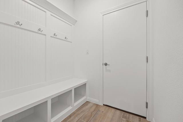 mudroom with light hardwood / wood-style floors