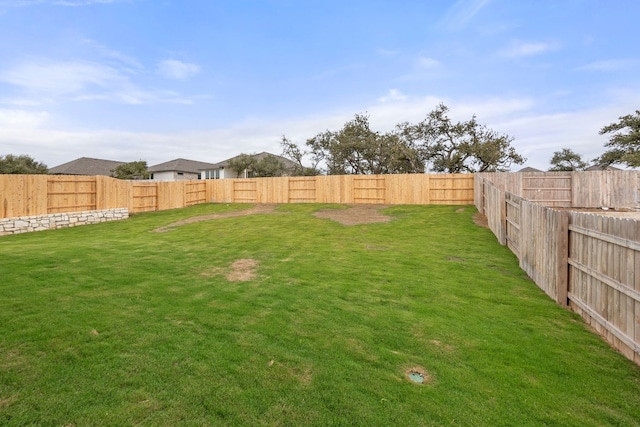 view of yard featuring a fenced backyard