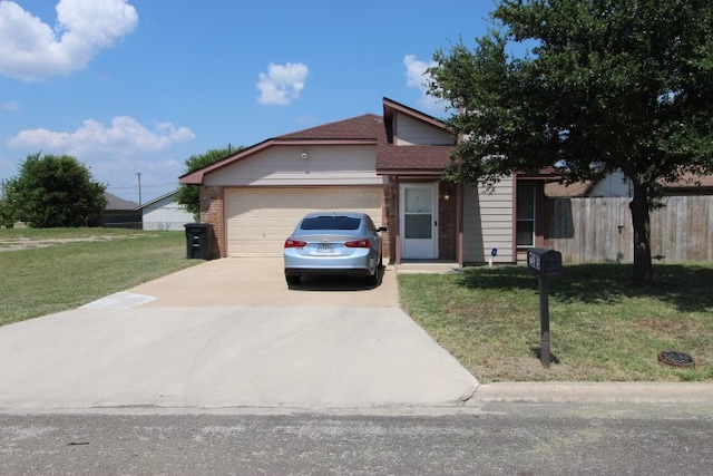 view of front facade with a front yard and a garage