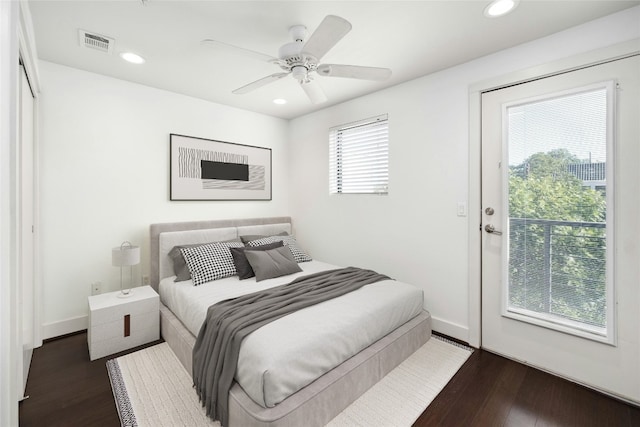 bedroom featuring ceiling fan and dark hardwood / wood-style flooring