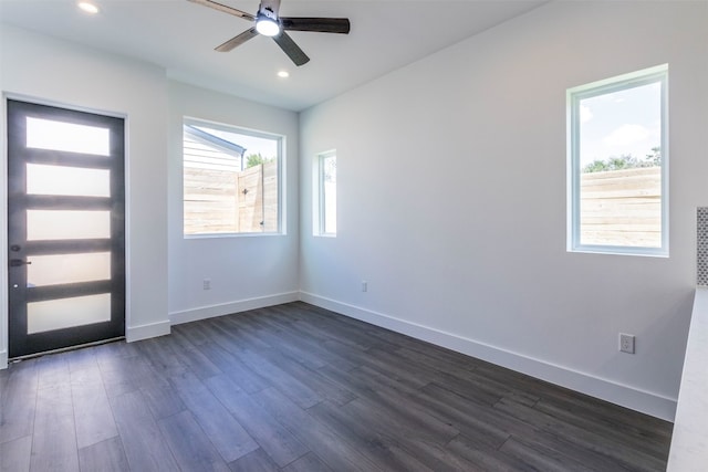 entrance foyer with ceiling fan and wood-type flooring