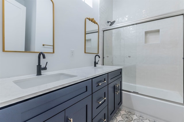 bathroom with combined bath / shower with glass door, double sink vanity, and tile patterned floors