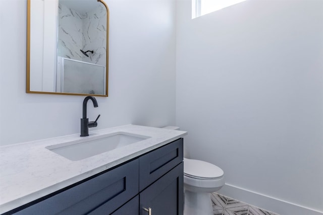 bathroom with tile patterned floors, toilet, and vanity