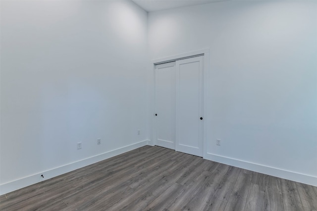 unfurnished room with hardwood / wood-style floors