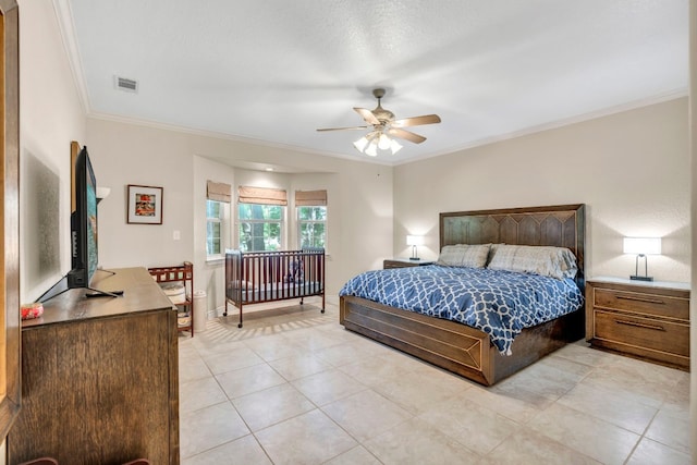 bedroom featuring light tile patterned floors, ceiling fan, and crown molding