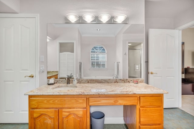 bathroom with walk in shower, vanity, tile patterned floors, and crown molding