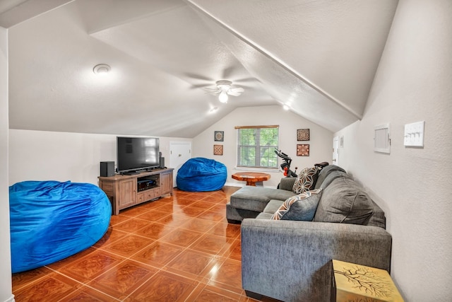 living room with ceiling fan, tile patterned floors, and vaulted ceiling