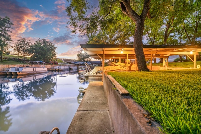 view of dock featuring a yard