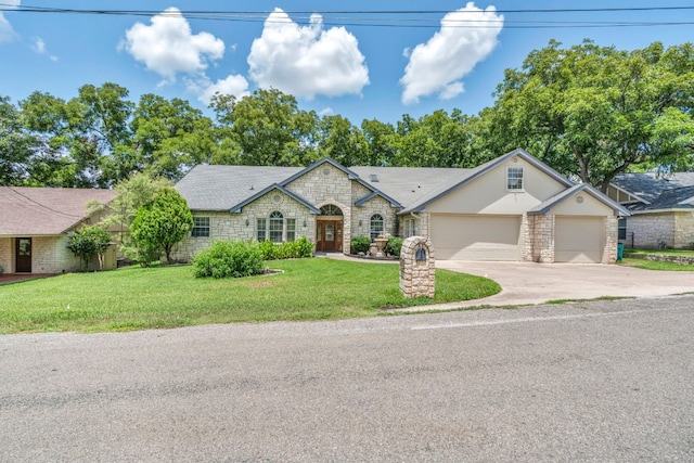 ranch-style house with a garage and a front lawn