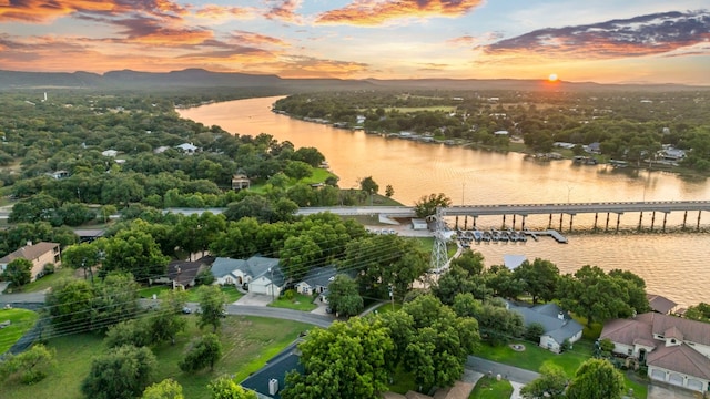 aerial view at dusk with a water view