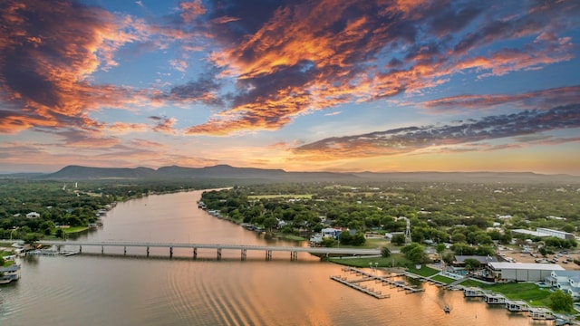 aerial view at dusk with a water and mountain view