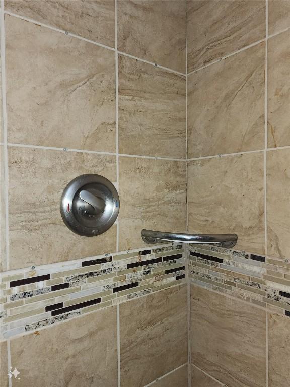 room details with a tile shower