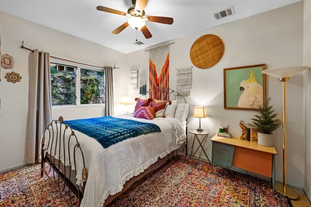 bedroom featuring visible vents, ceiling fan, and baseboards
