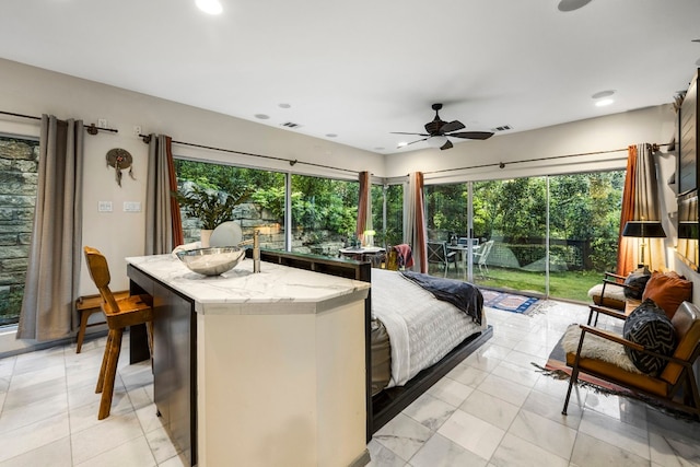 bedroom with access to outside and ceiling fan