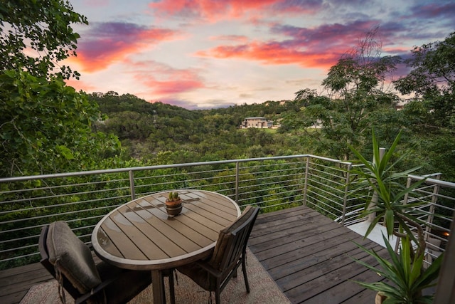 view of balcony at dusk