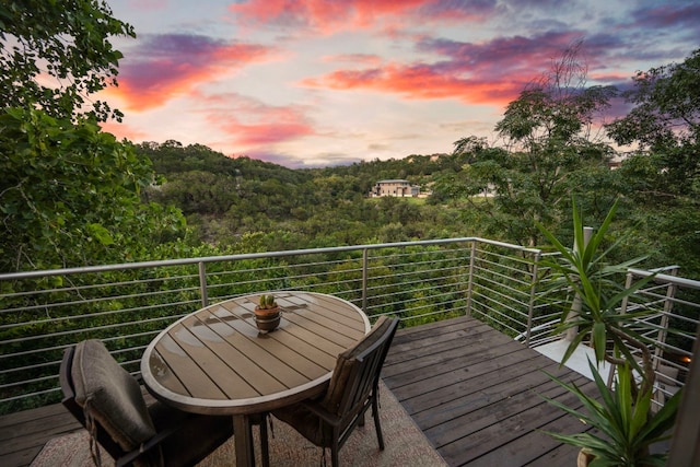 deck with outdoor dining area