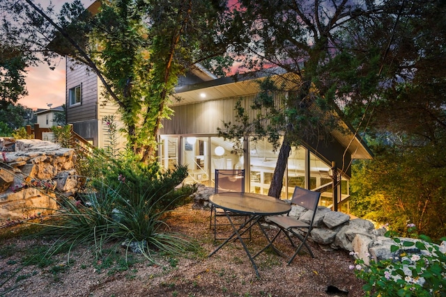 view of patio terrace at dusk