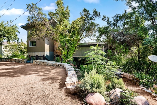 3025 Geronimo Trl, Austin, TX 78734 - view of side of home with stone siding