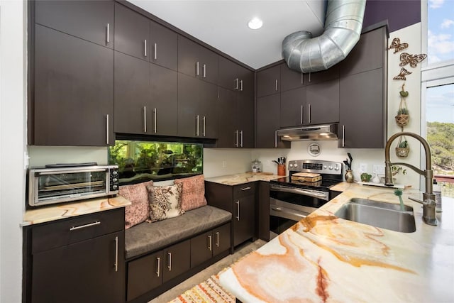 3025 Geronimo Trl, Austin, TX 78734 - kitchen with double oven range, under cabinet range hood, and recessed lighting