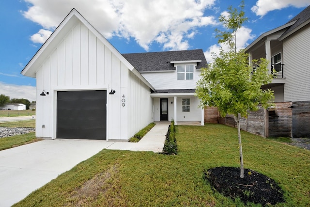 view of front facade with a garage and a front yard