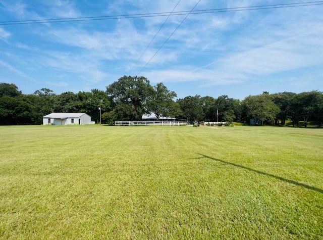 view of yard with a rural view