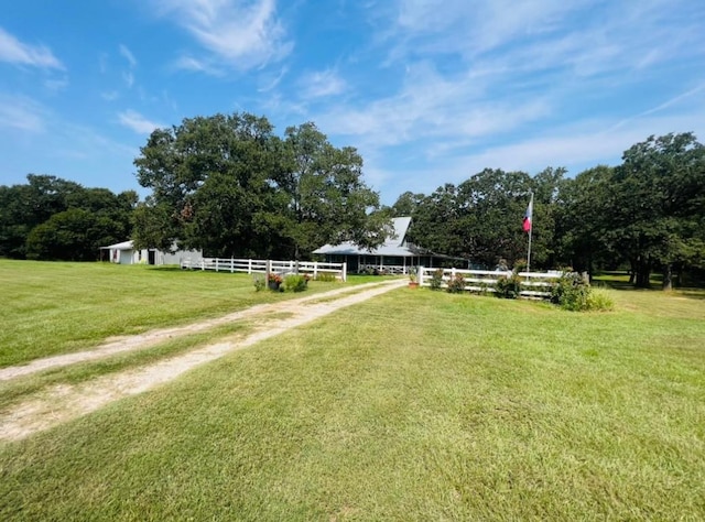 view of yard with a rural view