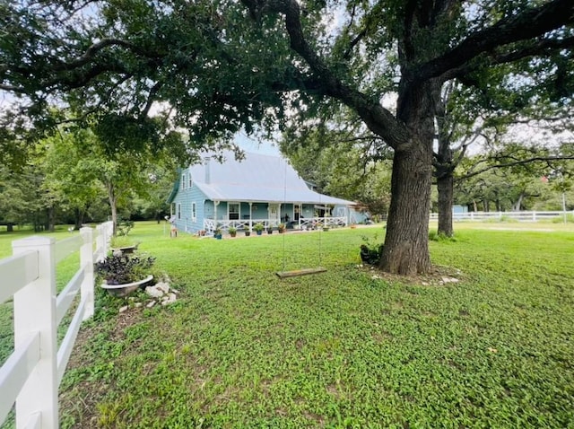 view of yard with covered porch