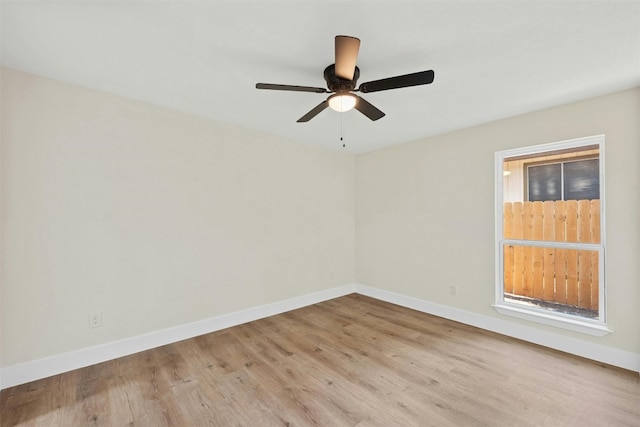 empty room with light hardwood / wood-style flooring and ceiling fan