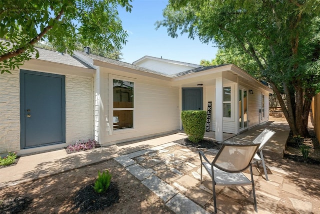 back of property with a patio area