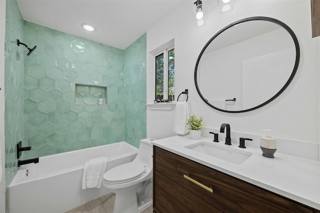 full bathroom featuring vanity, toilet, and tiled shower / bath