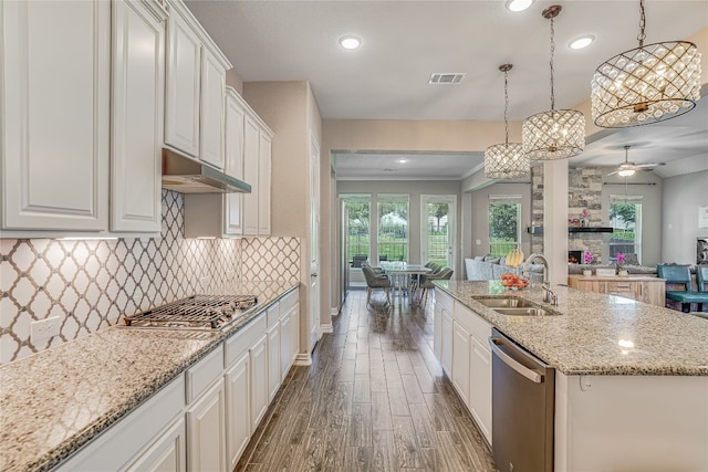 kitchen with ceiling fan, decorative backsplash, dark hardwood / wood-style floors, sink, and stainless steel appliances