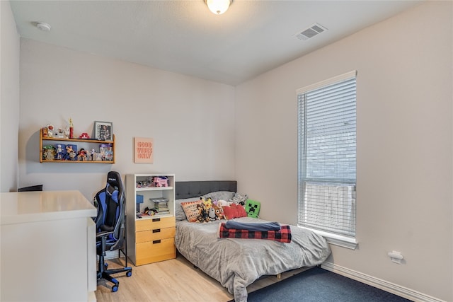 bedroom featuring light wood-type flooring