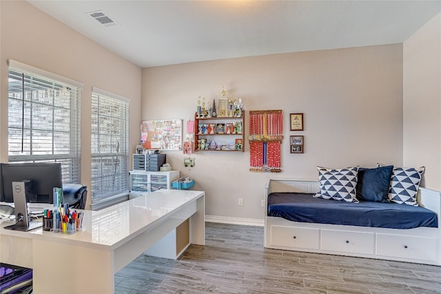 office with light hardwood / wood-style floors