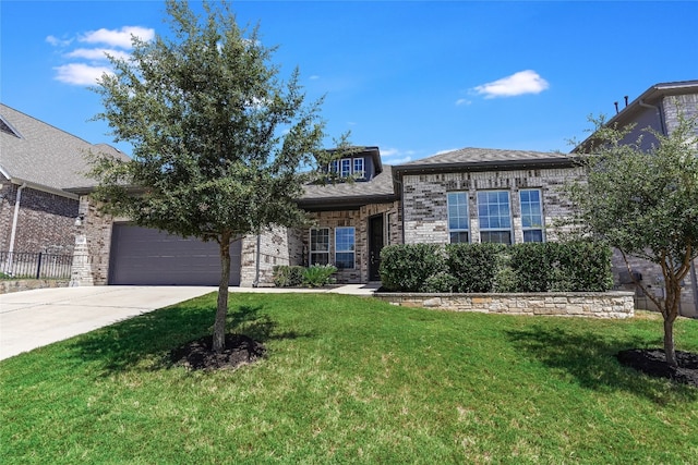 view of front of house featuring a front yard and a garage