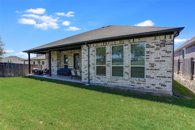 back of house featuring a lawn, outdoor lounge area, and a patio