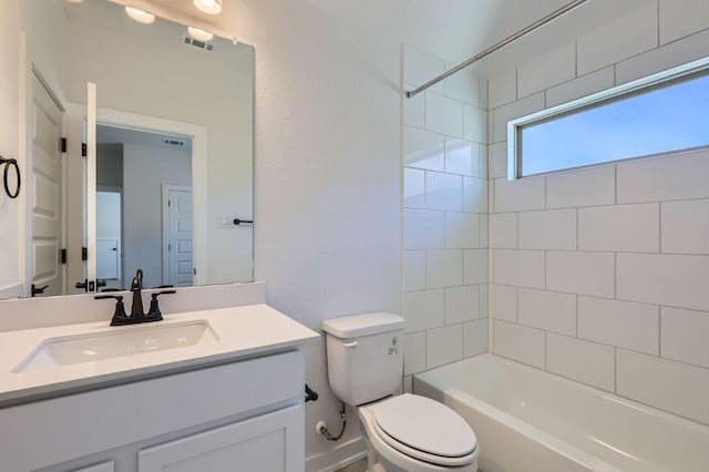 full bathroom with vanity, toilet, bathtub / shower combination, and visible vents