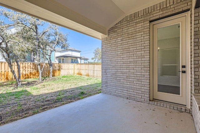 view of patio / terrace featuring fence