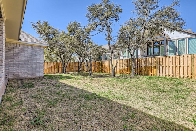 view of yard featuring a fenced backyard