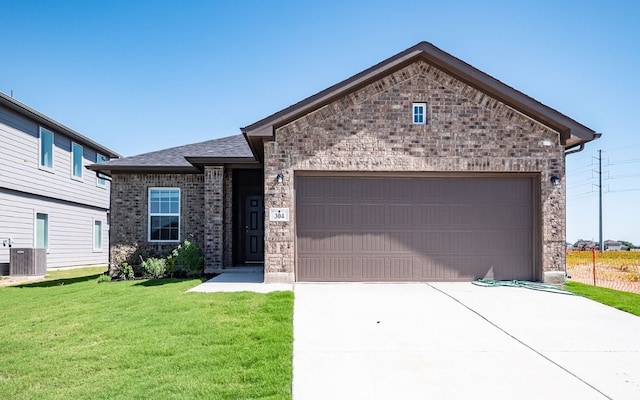 view of front of house with a front lawn and central AC unit